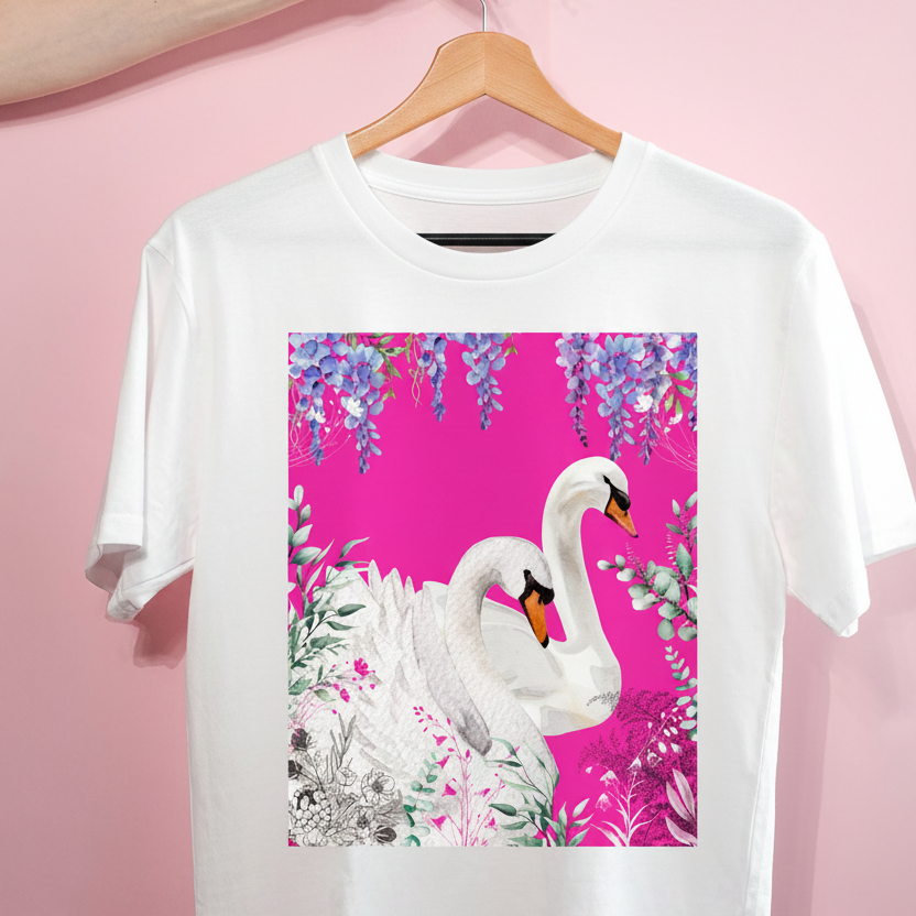 White t-shirt with a swan design on a pink background